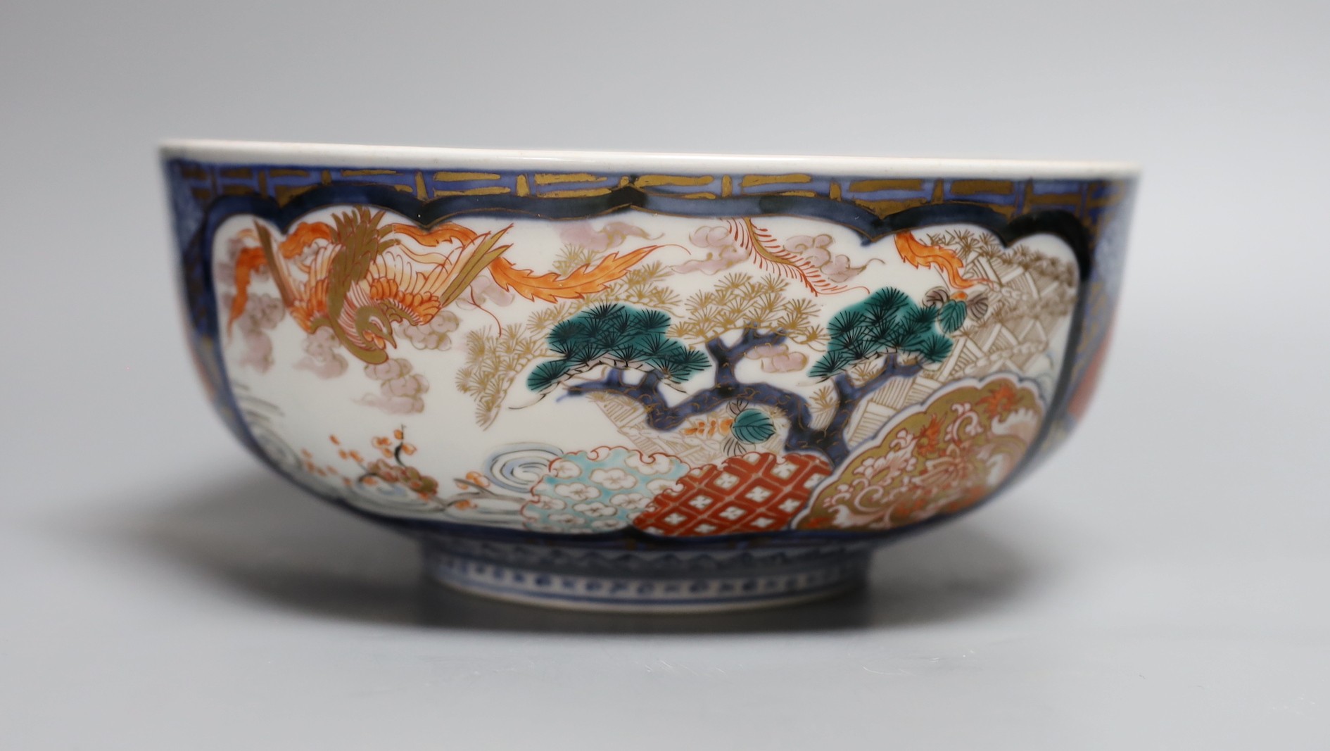 An 18th century Japanese Imari dish (af), another Imari dish, an 18th century Chinese export bowl (af) and a Chinese sang de boeuf vase, diameter of largest bowl 29cm